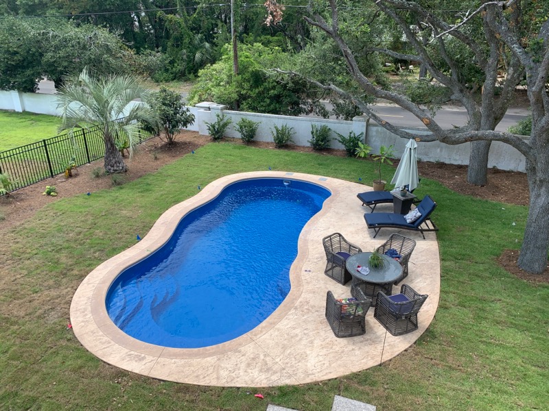 Leisure Pools Riviera 30 Sapphire Blue 2019 0801 wavy oval in-ground swimming pool in backyard
